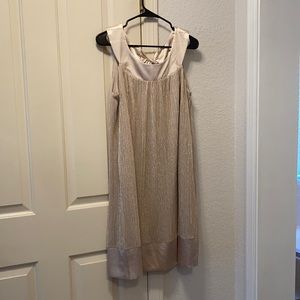 Gold sleeveless dress.